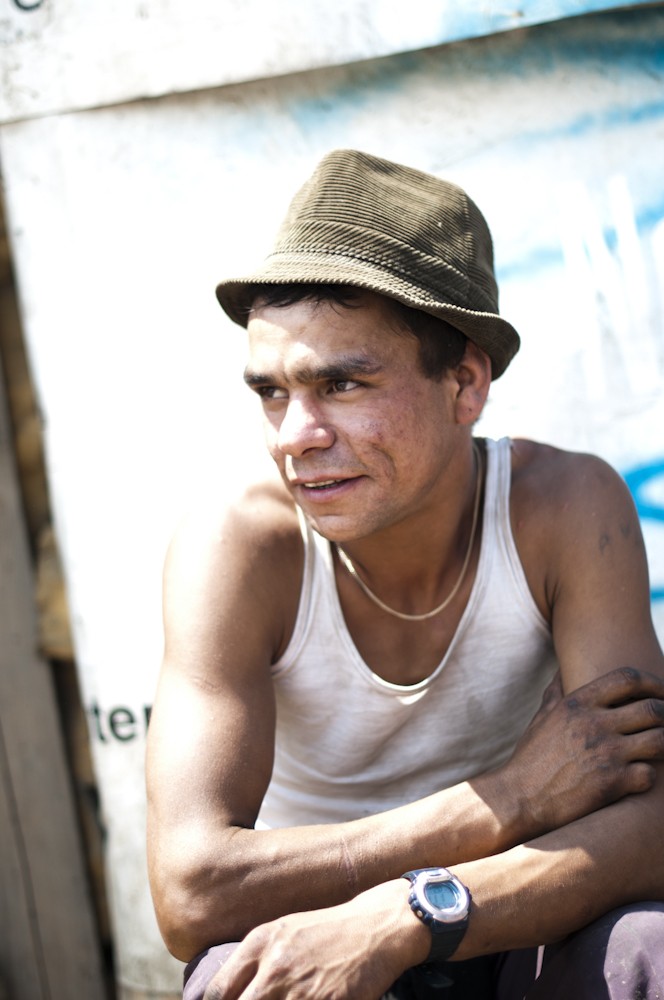Portrait of a man wearing a hat, photographed by Hannes Buchwald